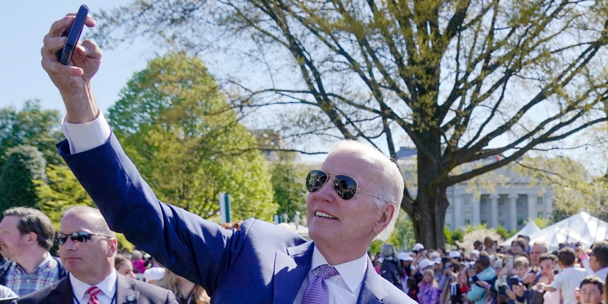 President Joe Biden takes a selfie with guests at the 2023 White House Easter Egg Roll, Monday, April 10, 2023, in Washington. (AP Photo/Evan Vucci)