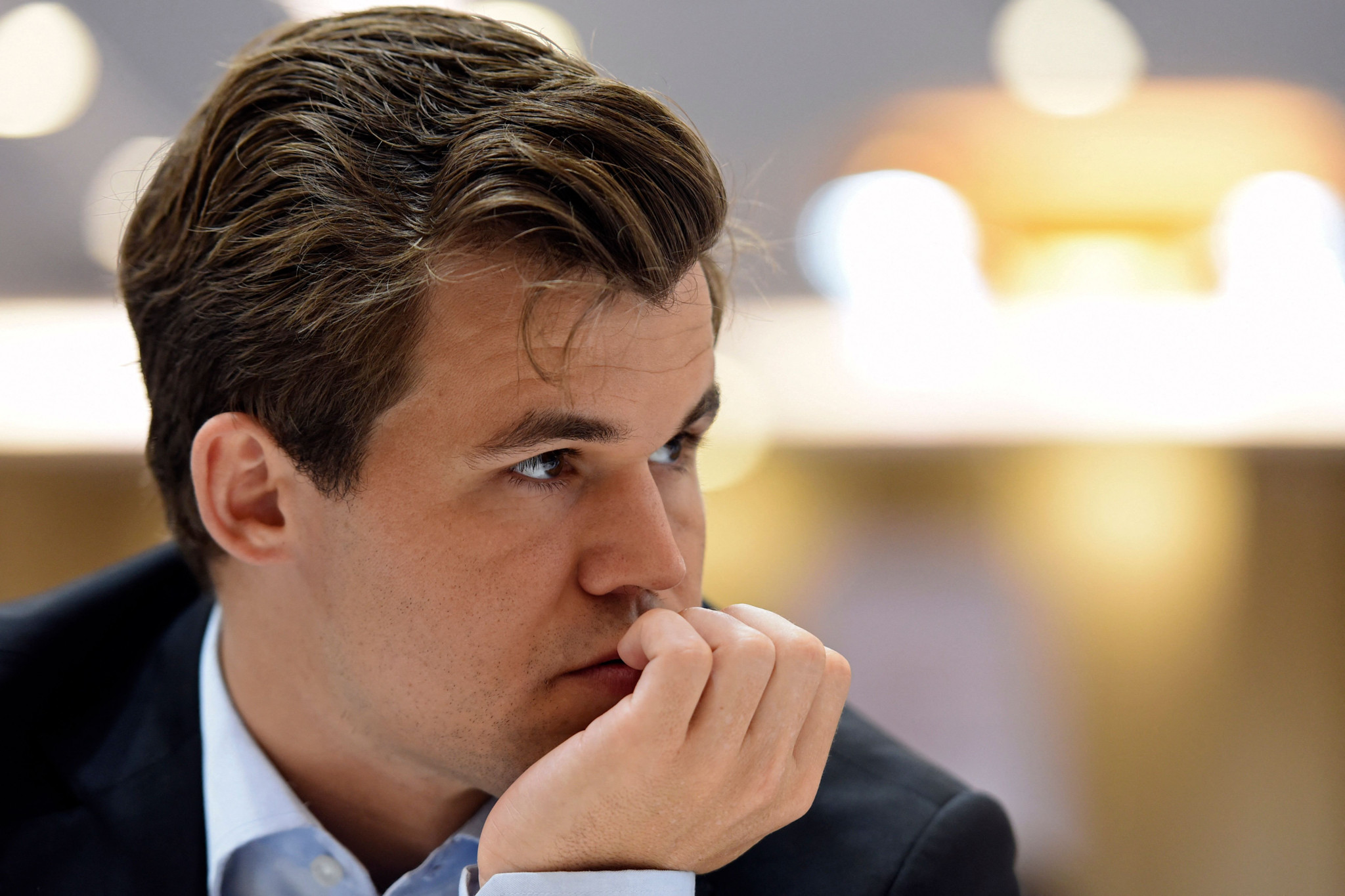 (FILES) Norway's Magnus Carlsen competes during his Round 10 game against the Moldova's team at the 44th Chess Olympiad 2022, in Mahabalipuram on August 8, 2022. Bored by the classic circuit and supported by a patron, the Norwegian Magnus Carlsen, chess star of which he has been the best player for ten years, is the leading figure of a movement which wants to stimulate new competitions and to highlight a variation of the game, 960 chess. (Photo by Arun SANKAR / AFP)