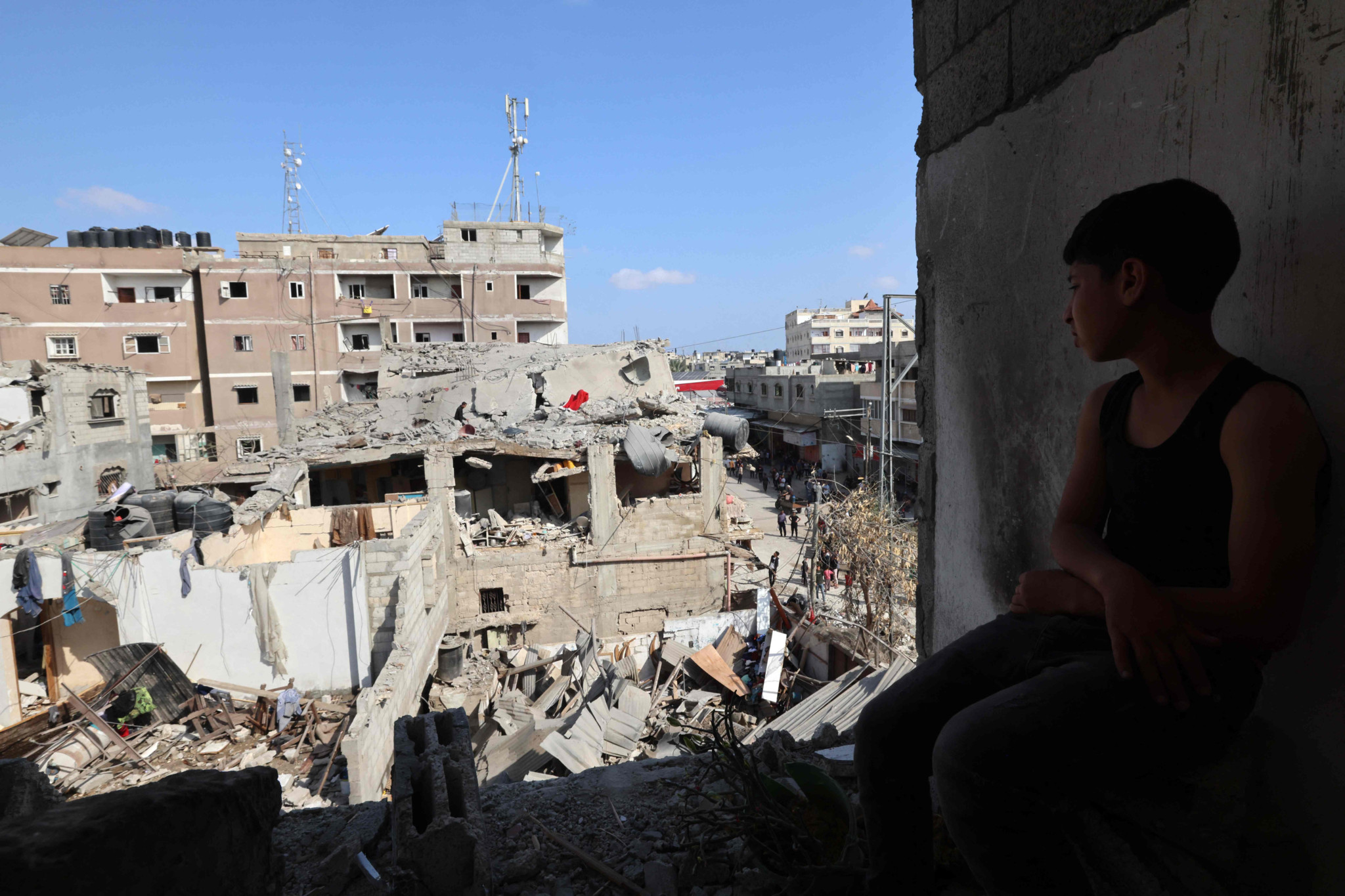 A Palestinian looks at the damage to buildings after Israeli bombardment in Rafah in the southern Gaza Strip, on April 29, 2024 amid the ongoing conflict between Israel and the Palestinian militant group Hamas. (Photo by AFP)