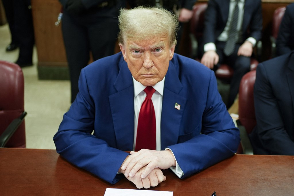 Former US President Donald Trump looks on in the courtroom, during his trial for allegedly covering up hush money payments linked to extramarital affairs, in New York City, on April 30, 2024. Trump, 77, is accused of falsifying business records to reimburse his lawyer, Michael Cohen, for a $130,000 hush money payment made to porn star Stormy Daniels just days ahead of the 2016 election against Hillary Clinton. (Photo by Seth Wenig / POOL / AFP)