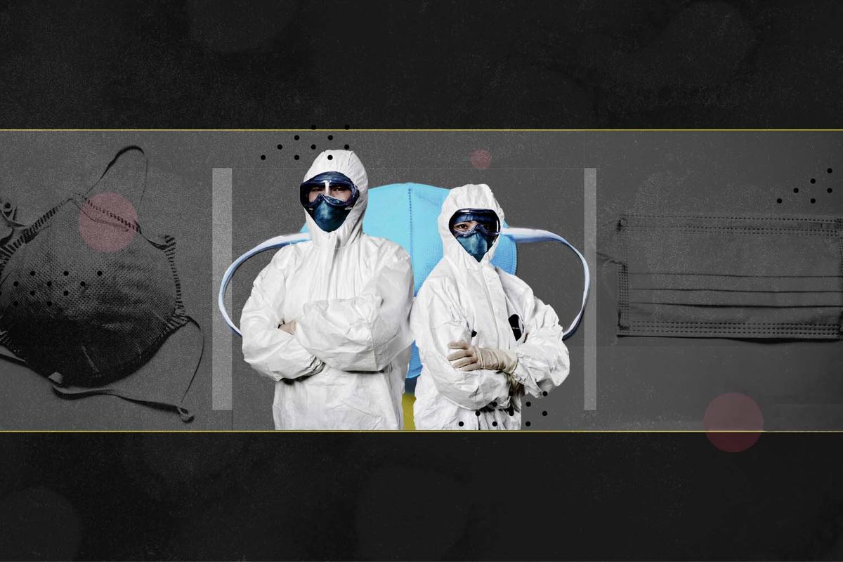 Two health care workers in full PPE — body suit, face mask, and goggles — stand back to back, in front of a stylized image of face masks.