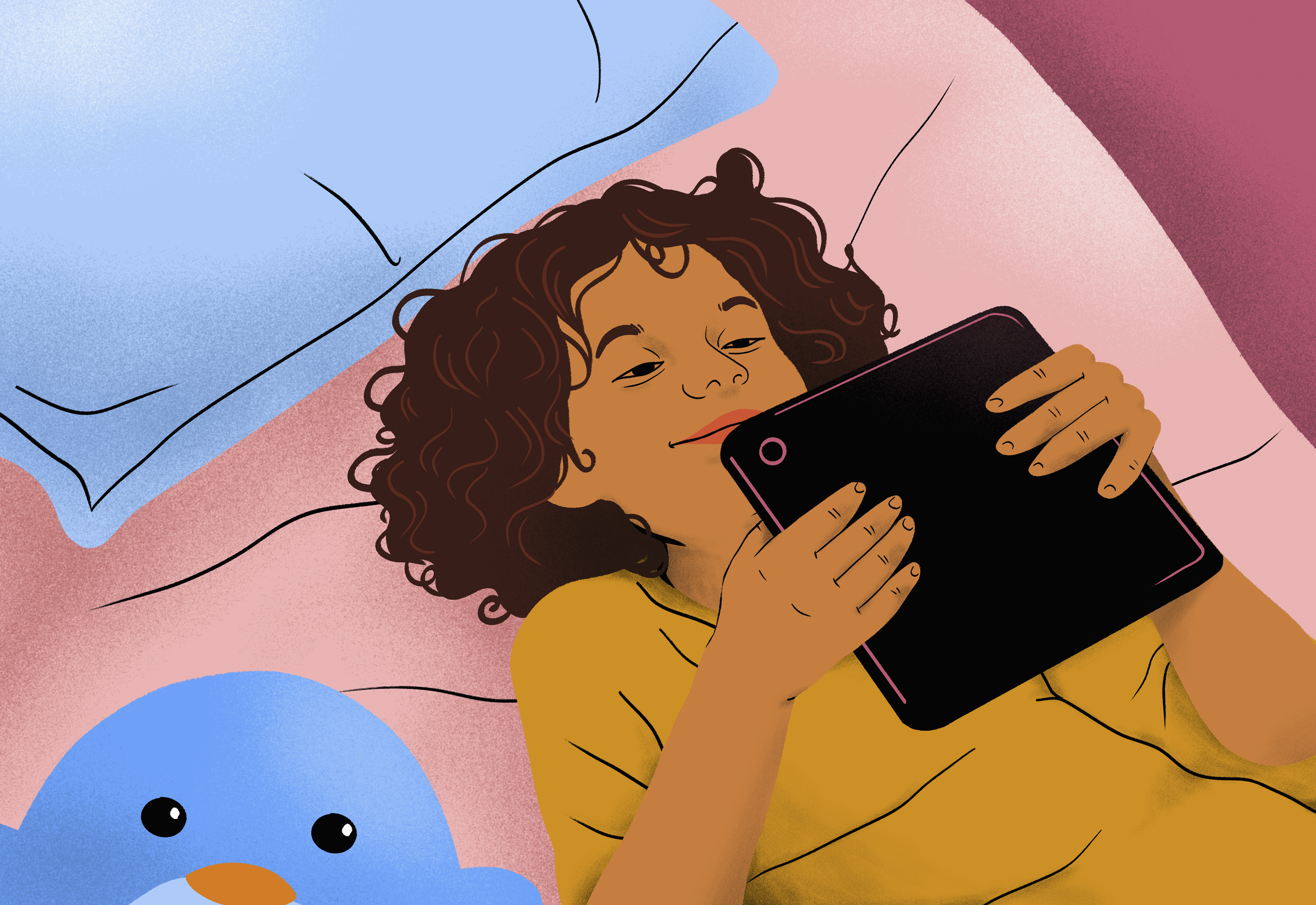 A child lies in bed on their back holding a tablet above them.