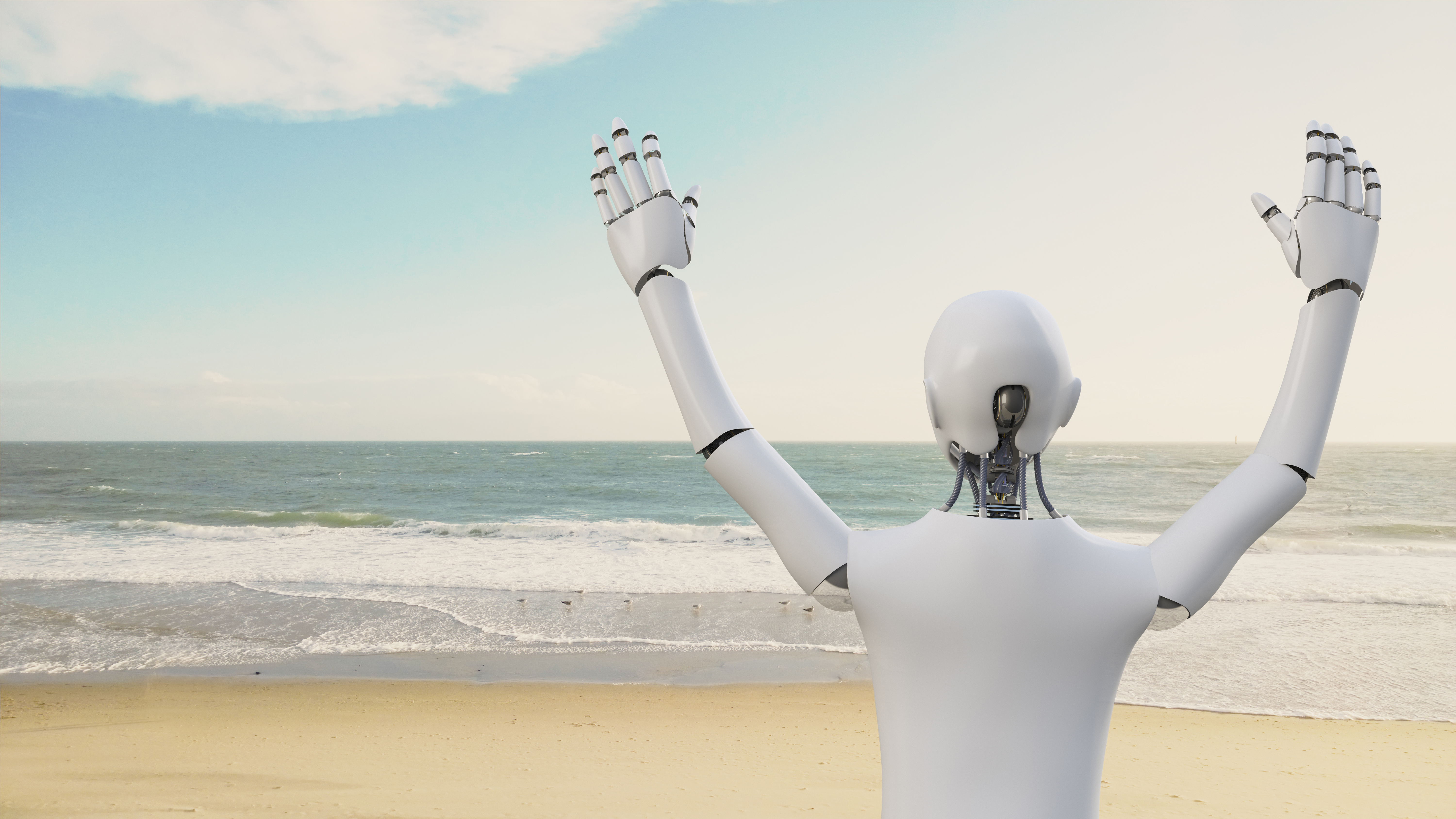 A robot raises its arms on a beach.