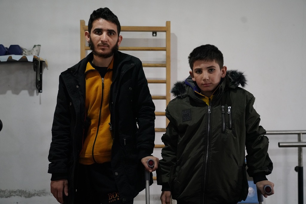 Nour (21) and his brother Ayman (12) at the Alhedaya Physiotherapy Centre in Dana-subdistrict in Idlib.    The brothers were both injured on 6 February 2023, when a magnitude 7.8 earthquake struck north-west Syria.