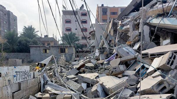 Обломки зданий, пострадавших в результате ракетных ударов ВС Израиля по Газе