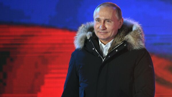 Владимир Путин во время митинга-концерта на Манежной площади в Москве