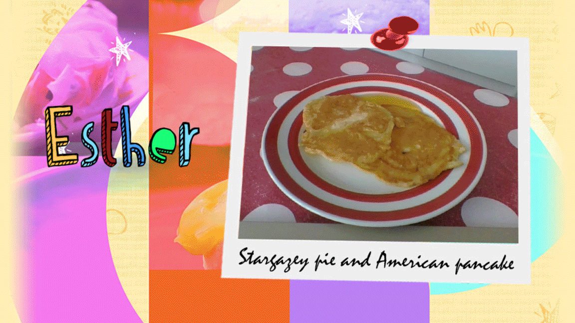 A girl shows a plate of the star gaze pie and pancakes that she has made.