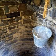 Image of a bucket hanging in a well