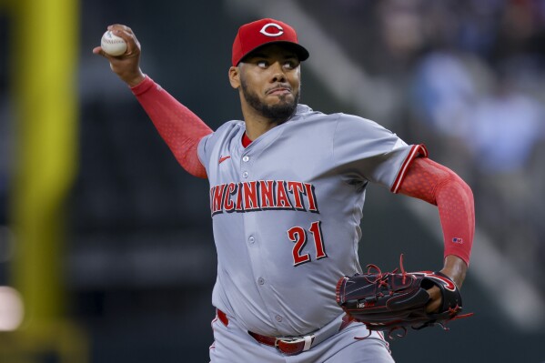 Cincinnati Reds starting pitcher Hunter Greene delivers during the first inning of a baseball game against the Texas Rangers in Arlington, Texas, Saturday, April 27, 2024. (AP Photo/Gareth Patterson)