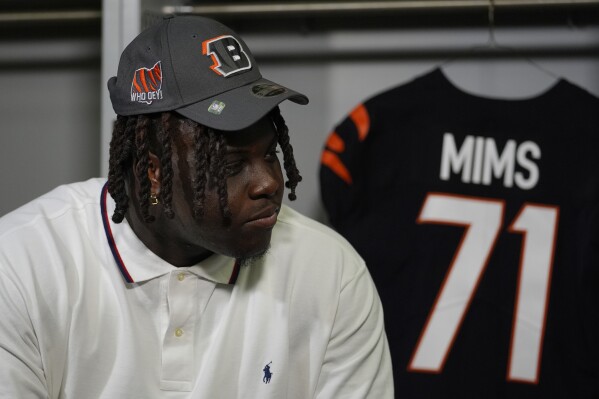 Cincinnati Bengals first round draft pick Amarius Mims pauses during a television interview following an NFL football news conference in Cincinnati, Friday, April 26, 2024. (AP Photo/Carolyn Kaster)