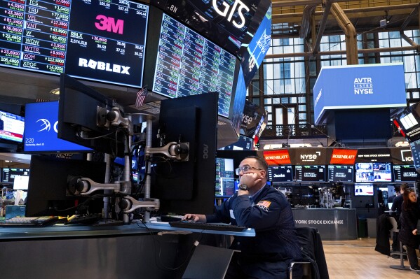 FILE = Traders work on the floor of the New York Stock Exchange Wednesday, March 20, 2024. U.S. markets are far outpacing their global counterparts in 2024, continuing a decades-long trend of strong growth compared with the rest of the world. (AP Photo/Craig Ruttle, File)