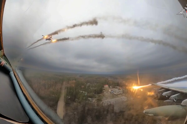 FILE – A Su-25 plane is seen firing rockets over Ukraine in a video frame grab. The video was taken from inside another Su-25 plane and released by the Russian Defense Ministry on Jan. 22, 2024. (Russian Defense Ministry Press Service via AP, File)