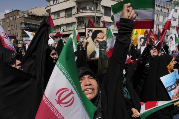 Iranian worshippers chant slogans during an anti-Israeli gathering after Friday prayers in Tehran, Iran, Friday, April 19, 2024. An apparent Israeli drone attack on Iran saw troops fire air defenses at a major air base and a nuclear site early Friday morning near the central city of Isfahan, an assault coming in retaliation for Tehran's unprecedented drone-and-missile assault on the country. (AP Photo/Vahid Salemi)