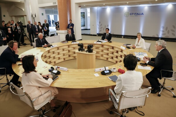 British Foreign Secretary David Cameron, left, European Union foreign policy chief Josep Borrell, top left, U.S. Secretary of State Antony Blinken, top, second from left, German Foreign Minister Annalena Baerbock, bottom left, Japanese Foreign Minister Yoko Kamikawa, bottom right, Canadian Minister of Foreign Affairs Melanie Joly, top right, French Foreign Minister Stephane Sejourne and Italian Foreign Minister Antonio Tajani, right, meet on the second day of a G7 foreign ministers meeting on Capri island, Italy, Thursday April 18, 2024. (Remo Casilli/Pool via AP)