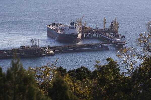 FILE - An oil tanker is moored at the Sheskharis complex, part of Chernomortransneft JSC, a subsidiary of Transneft PJSC, the largest facilities for oil and petroleum products in southern Russia, in Novorossiysk, Tuesday, Oct. 11, 2022. Russia's still making plenty of money from oil sales despite a price cap imposed by the Group of Seven major democracies. Researchers at Helsinki's Centre for Research on Energy and Clean Air said in report Wednesday Jan. 11, 2023 that the cap is too lenient at $60 per barrel. (AP Photo, File)