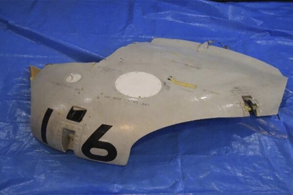 This image released by Japan Maritime Self-Defense Force shows a retrieved component which is believed to be a part of a crashed helicopter, Sunday, April 21, 2024. Initial analysis of flight data recorders recovered from the waters in the Pacific near the crash site of the two Japanese navy helicopters showed no sign that mechanical problems in the aircraft caused the accident, Japan’s defense minister said Monday, as he indicated human error. (Japan Maritime Self-Defense Force via AP)