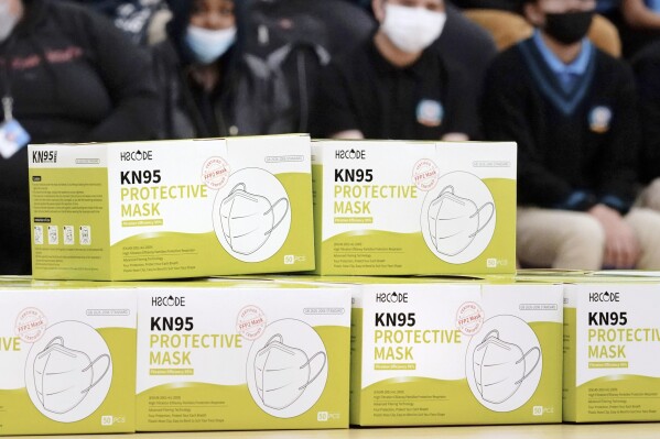 FILE - Boxes of KN95 protective masks are stacked together before being distributed to students at Camden High School in Camden, N.J., Wednesday, Feb. 9, 2022. A federal appeals court shot down claims that New Jersey residents' refusal to wear face masks during the COVID-19 outbreak at school board meetings constituted protected speech under the First Amendment. The 3rd Circuit Court of Appeals issued a ruling Monday, Feb. 5, 2024, in two related cases stemming from lawsuits against officials in Freehold and Cranford, N.J. (AP Photo/Matt Rourke, File)