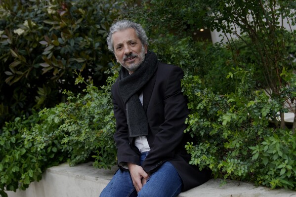 Farid Alilat, a writer for the French-language magazine Jeune Afrique poses for photo in Paris, France, Tuesday, April 16, 2024. Alilat was expelled from Algeria after flying in from France and not being allowed to leave the airport as journalists continue to face challenges reporting in Algeria. (AP Photo/Christophe Ena)