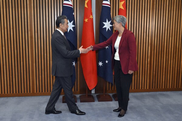 China's Foreign Minister Wang Yi, left, meets with Australia's Minister for Foreign Affairs Penny Wong at Parliament House in Canberra, Wednesday, March 20, 2024. Wang met his counterpart as part of a high-ranking diplomatic tour of Australia and New Zealand this week. (Mick Tsikas/AAP Image via AP)