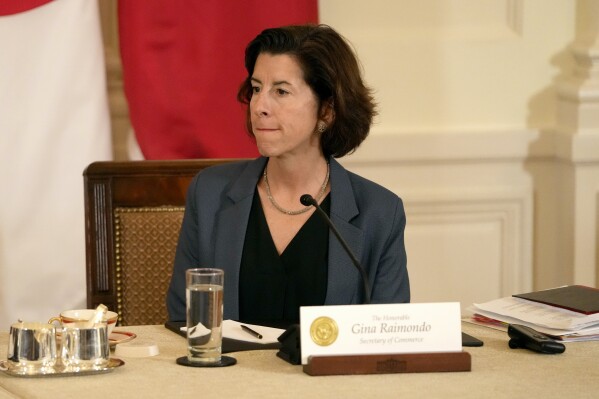 Commerce Secretary Gina Raimondo attends a trilateral meeting with President Joe Biden, Philippine President Ferdinand Marcos Jr., and Japanese Prime Minister Fumio Kishida in the East Room of the White House in Washington, Thursday, April 11, 2024. (AP Photo/Mark Schiefelbein)