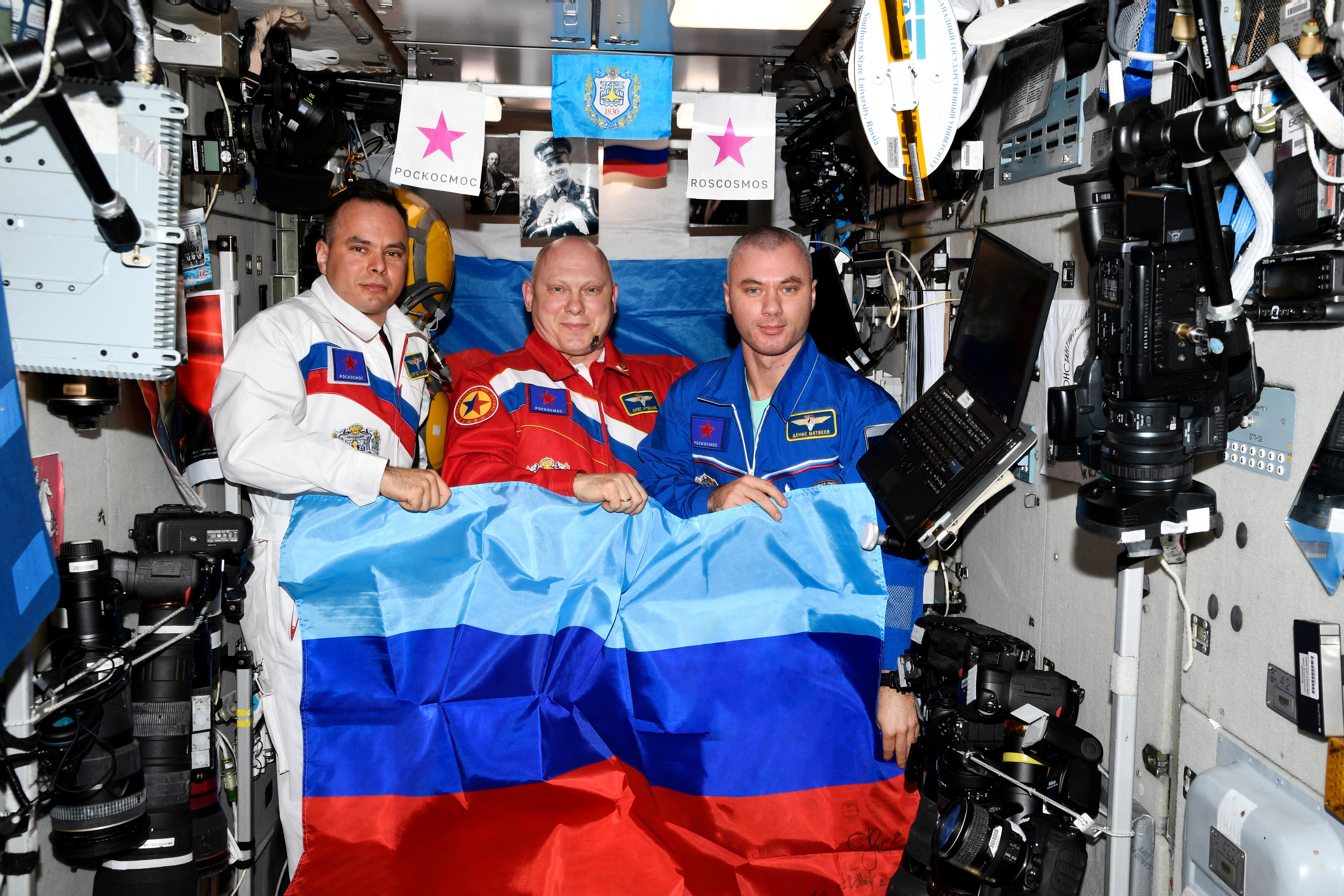 Russian cosmonauts Oleg Artemyev, Denis Matveev and Sergey Korsakov pose with a flag of the self-proclaimed Luhansk People's Republic at the International Space Station (ISS), in this picture released on July 4. 