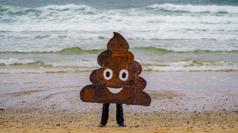 Campaigners gather on Fistral Beach, Newquay, as they take part in a National Day of Action on Sewage Pollution in April