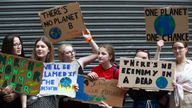 People hold placards as they attend a climate change demonstration in London, Britain, June 26, 2019. REUTERS/Hannah McKay