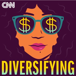 A woman of color wears sunglasses with dollar signs on the lenses