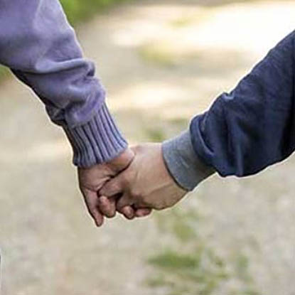 Two people holding hands