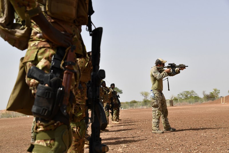 A U.S. Army instructor demonstrates a weapon to Malian soldiers on April 12, 2018, during an anti-terrorism exercise at a military camp near Ouagadougo, Burkina Faso.