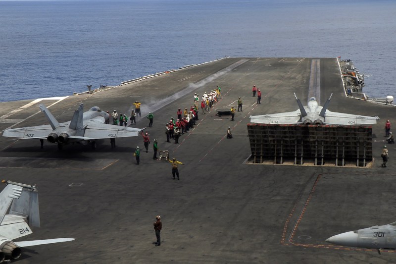 Fighter jets preparing to take off from the flight deck of USS Ronald Reagan aircraft carrier as it sails in South China Sea on its way to Singapore on Oct. 16, 2019.