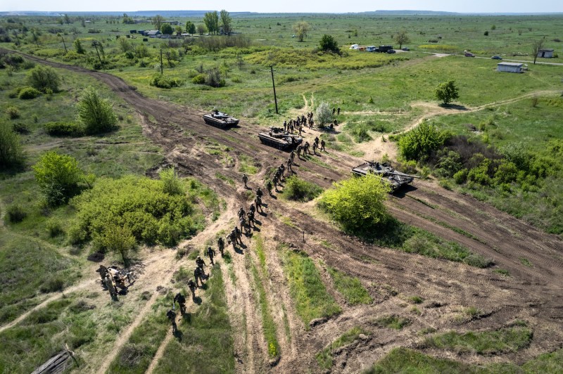 Ukrainian infantry take part in a training exercise with tanks near Dnipropetrovsk oblast, Ukraine, less than 50 miles from the front lines, on May 9.
