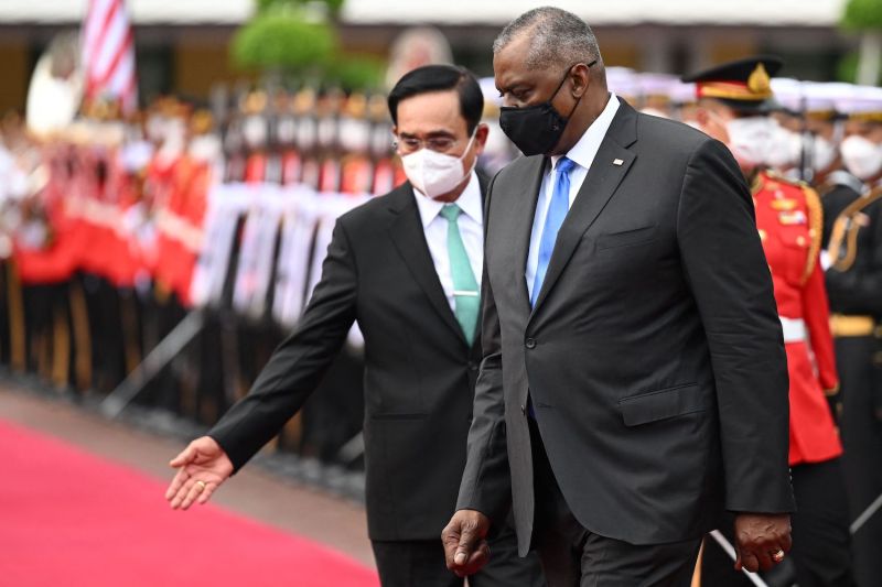 Thai Prime Minister Prayuth Chan-ocha gestures to U.S. Defense Secretary Lloyd Austin.