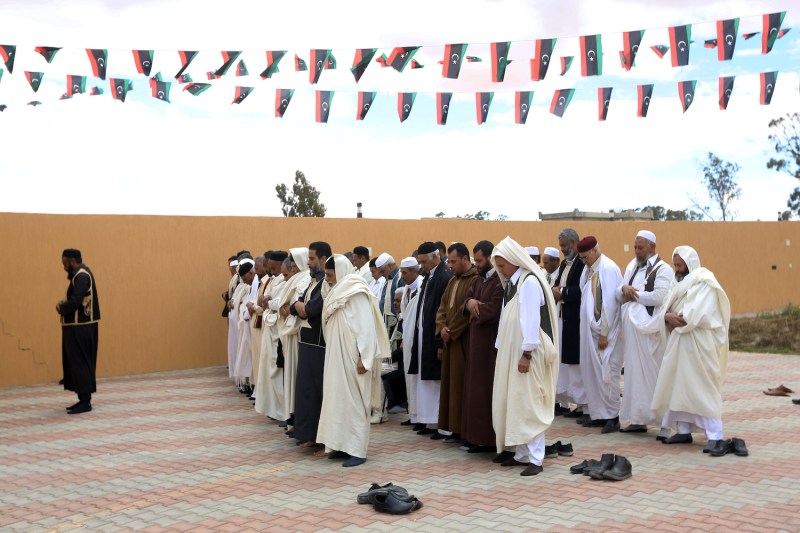 Libyan tribal leaders pray in the city of Zintan on March 28, 2018.