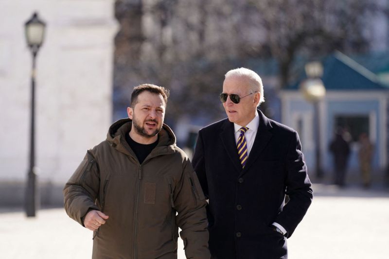 U.S. President Joe Biden walks with Ukrainian President Volodymyr Zelensky in Kyiv.