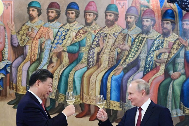 Russian President Vladimir Putin and Chinese President Xi Jinping make a toast at the Kremlin in Moscow on March 21.