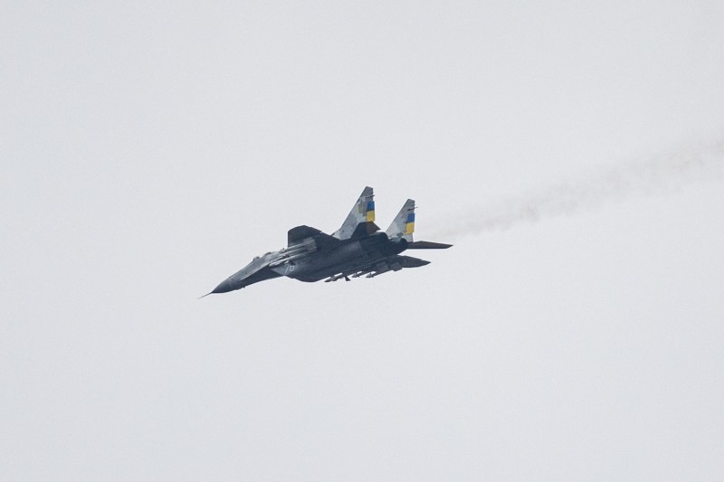 An MIG-29 Ukrainian fighter jet flies over eastern Ukraine against a pale gray sky on Jan. 1.