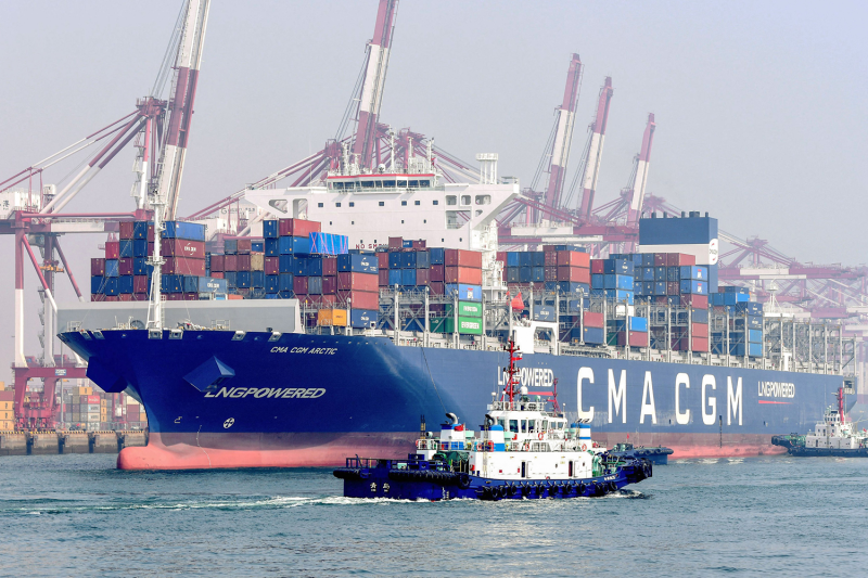 This photo taken on March 7 shows a cargo ship powered by LNG (Liquefied Natural Gas) loaded with containers at a port in Qingdao, in China's eastern Shandong province.