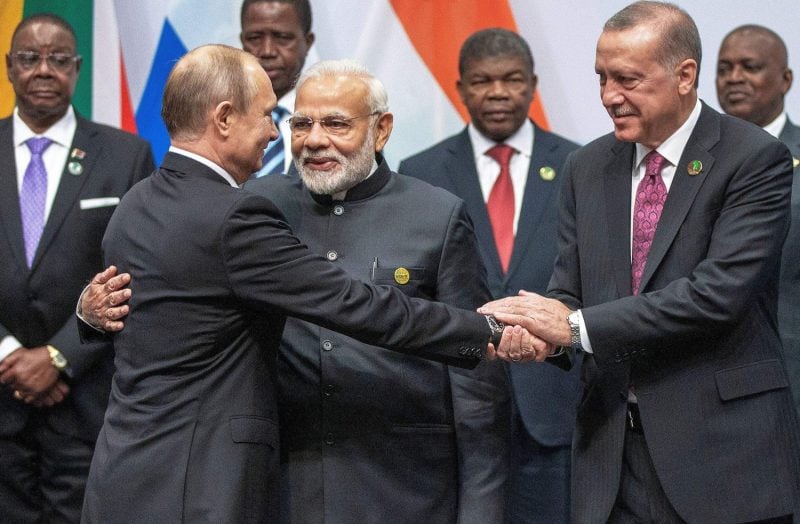Russian President Vladimir Putin, Indian Prime Minister Narendra Modi, and Turkish President Recep Tayyip Erdogan greet each other at the BRICS summit in Johannesburg, South Africa, on July 27, 2018.