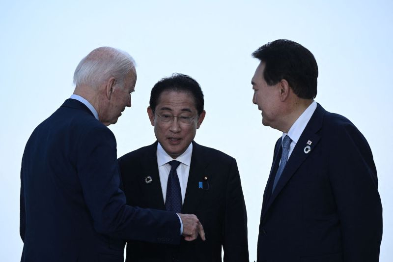 U.S. President Joe Biden, Japanese Prime Minister Fumio Kishida, and South Korean President Yoon Suk Yeol greet each other ahead of a meeting during the G7 Leaders' Summit in Hiroshima, Japan on May 21.