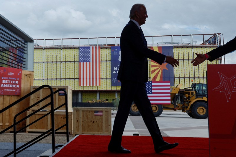 Joe Biden walks across a stage.