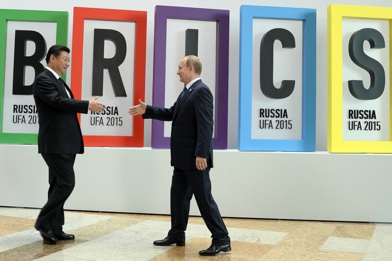 Russian President Vladimir Putin greets Chinese President Xi Jinping during a welcome ceremony at the start of the 7th BRICS summit in Ufa, Russia.