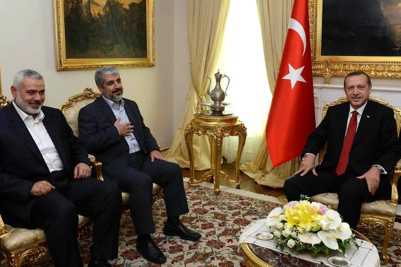 Then-Turkish Prime Minister Recep Tayyip Erdogan meets with senior Hamas leaders Khaled Mashal (center) and Ismail Haniyeh in Ankara on June 18, 2013.