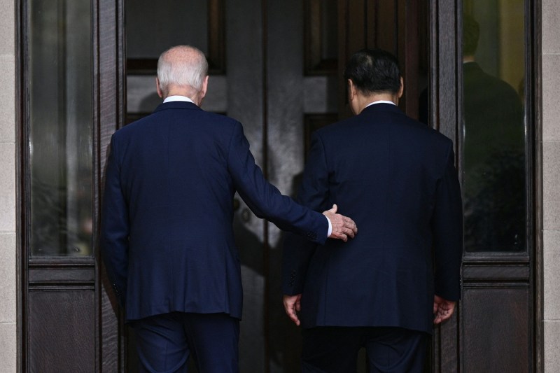 U.S. President Joe Biden (left) and Chinese President Xi Jinping arrive for a meeting of the Asia-Pacific Economic Cooperation forum.