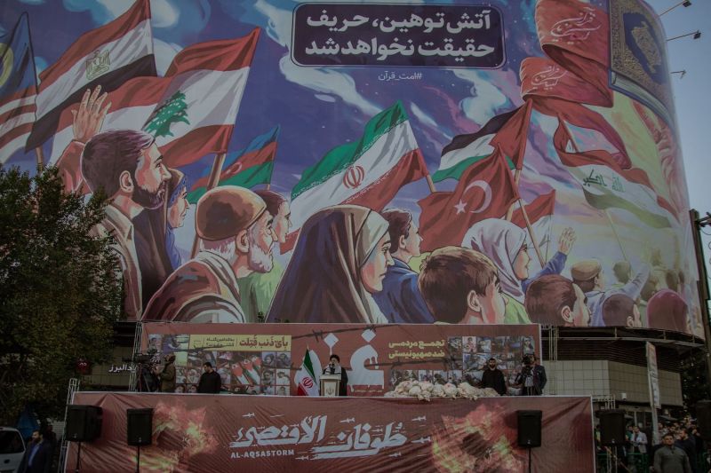 In a pro-government demonstration on October 18, 2023, in Tehran, Iran, mock body bags are placed on the podium as Iranian President Ebrahim Raisi addresses the crowds.