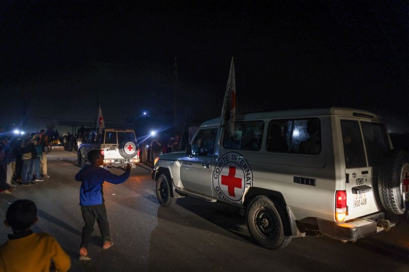 International Red Cross vehicles reportedly carrying hostages released by Hamas cross the Rafah border point in Gaza on the way to Egypt, from which they were flown to Israel to be reunited with their families, on Nov. 24.
