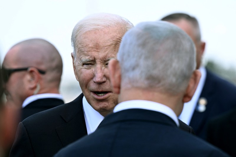 Israeli Prime Minister Benjamin Netanyahu (back) greets U.S. President Joe Biden upon his arrival at Tel Aviv’s Ben Gurion Airport.