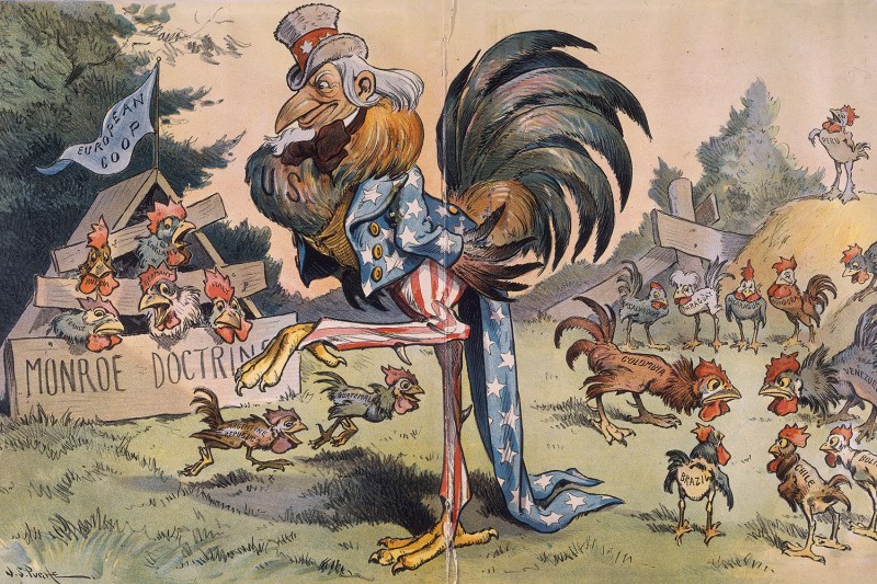 A 1901 political cartoon depicts an Uncle Sam rooster (large and central wearing a top hat and stars and stripe suit) with small roosters in the Monroe Doctrine-labeled European Coop (left) and smaller roosters labeled with South American country names including Colombia, Guatemala, Brazil, Chile, Uruguay, Peru, and others running around free.