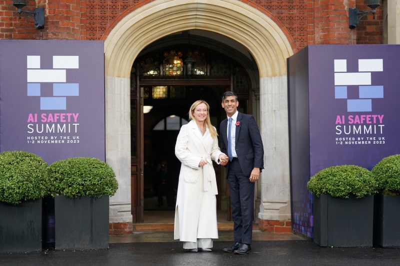 British Prime Minister Rishi Sunak welcomes Italian Prime Minister Giorgia Meloni during the AI Safety Summit in England.