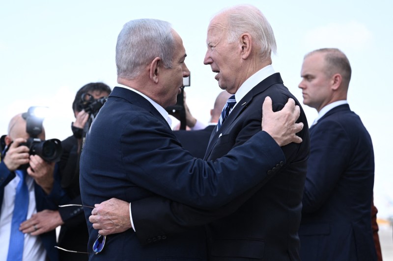 Israel Prime Minister Benjamin Netanyahu greets U.S. President Joe Biden upon his arrival at Tel Aviv.
